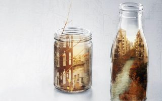 an image of a bottle with a picture of a city inside of it