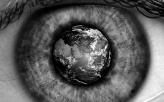an image of a close up of a person ' s eye with a planet in the center