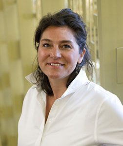 an image of a woman standing in a bathroom with a toothbrush
