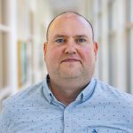 Professional headshot of Rob Colson