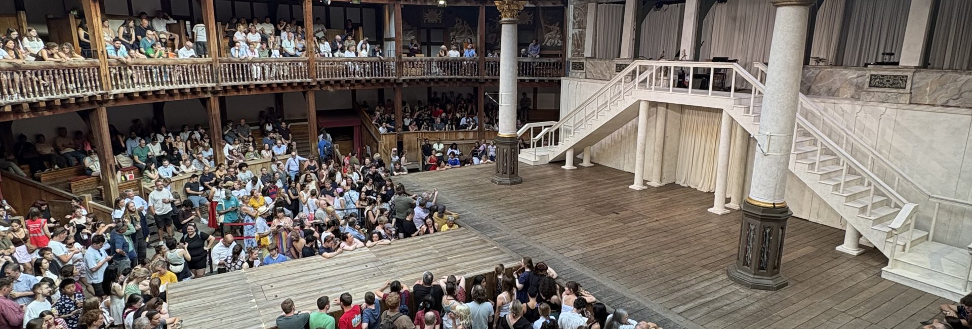 A view of the Globe Theatre in London, including a live audience