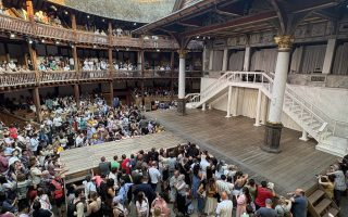 A view of the Globe Theatre in London, including a live audience